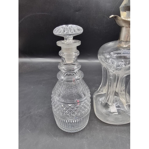 1452 - A silver mounted clear glass kluck kluck decanter and stopper, 27.5cm high; together with another pa... 