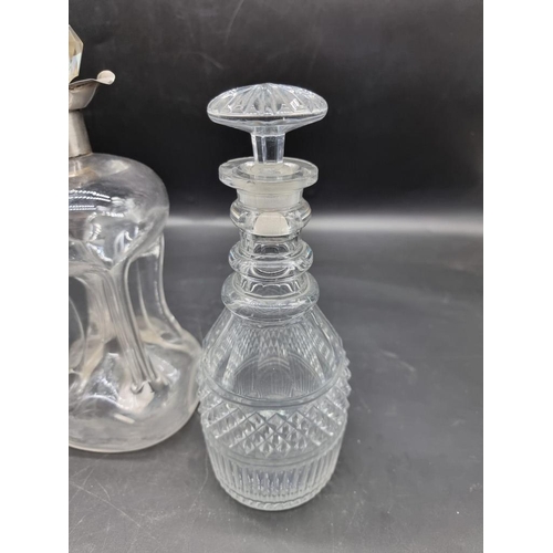 1452 - A silver mounted clear glass kluck kluck decanter and stopper, 27.5cm high; together with another pa... 