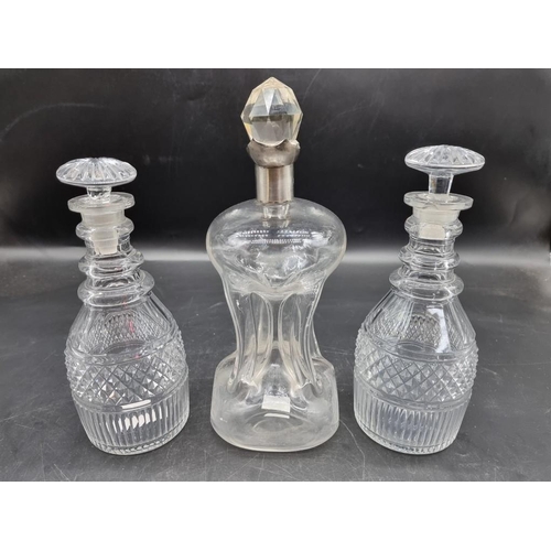 1452 - A silver mounted clear glass kluck kluck decanter and stopper, 27.5cm high; together with another pa... 