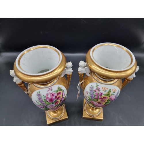 1453 - A pair of 19th century Continental porcelain twin handled vases, 29.5cm high, (s.d. to one).... 