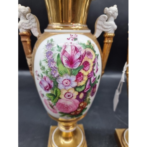 1453 - A pair of 19th century Continental porcelain twin handled vases, 29.5cm high, (s.d. to one).... 