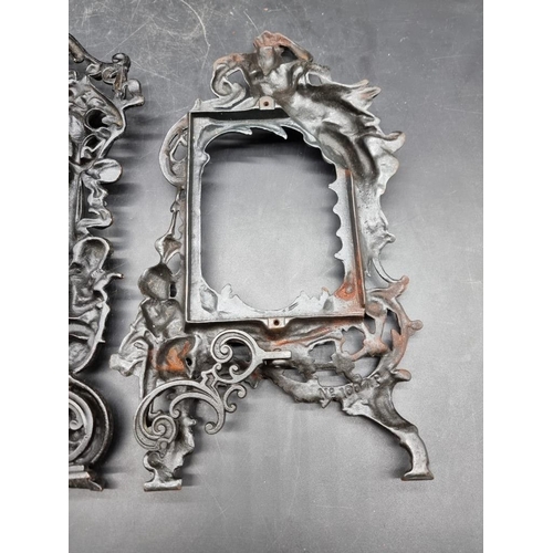 1457 - Two cast iron easel back photograph frames, largest 34.5cm high.