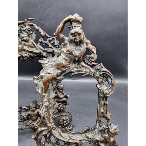 1457 - Two cast iron easel back photograph frames, largest 34.5cm high.