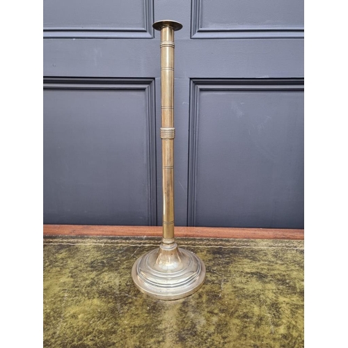 1458 - Two similar large 19th century brass ejecting candlestick, largest 50cm high, (one s.d.). (2)... 