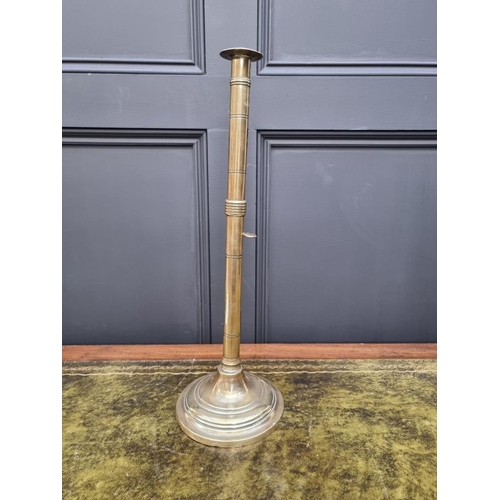 1458 - Two similar large 19th century brass ejecting candlestick, largest 50cm high, (one s.d.). (2)... 