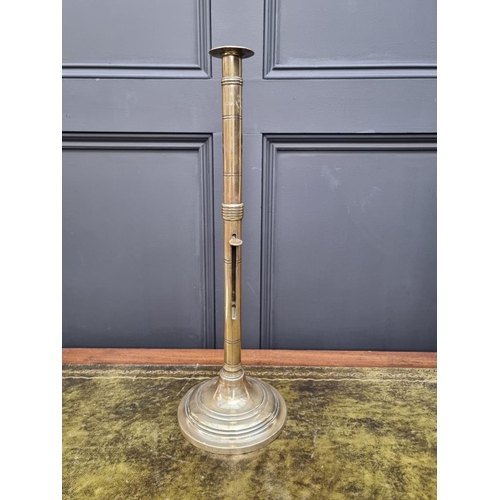 1458 - Two similar large 19th century brass ejecting candlestick, largest 50cm high, (one s.d.). (2)... 