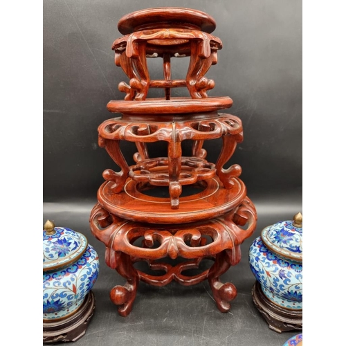 1464 - A small collection of Chinese items, to include a graduated set of three hardwood stands; and c... 