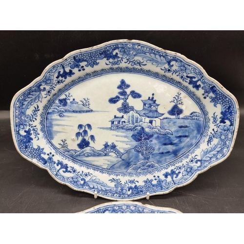 1465 - A pair of Chinese blue and white oval dishes, 18th century, 33.5cm wide; together with a famill... 