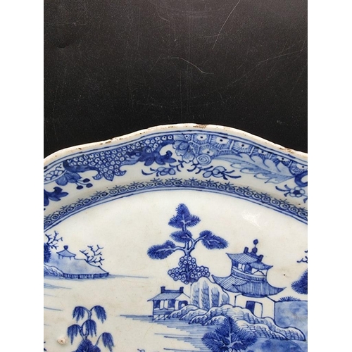 1465 - A pair of Chinese blue and white oval dishes, 18th century, 33.5cm wide; together with a famill... 