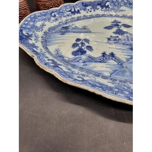 1465 - A pair of Chinese blue and white oval dishes, 18th century, 33.5cm wide; together with a famill... 