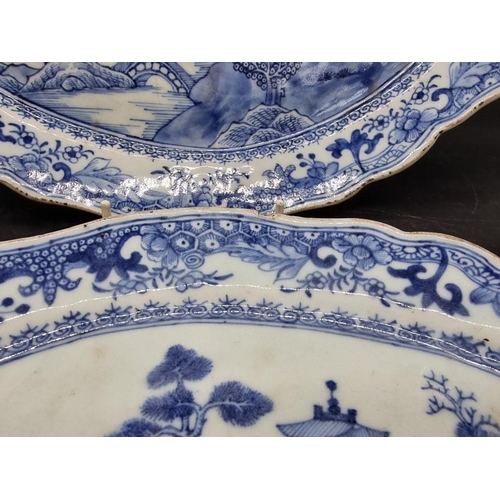 1465 - A pair of Chinese blue and white oval dishes, 18th century, 33.5cm wide; together with a famill... 