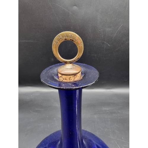 1471 - WITHDRAWN FROM SALE: A Bristol blue glass decanter and brass stopper; together with a Royal Doulton ... 