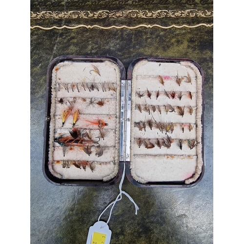 1496 - Angling: a Hardy Bakelite Oxblood dry fly fishing box, enclosing various flies.