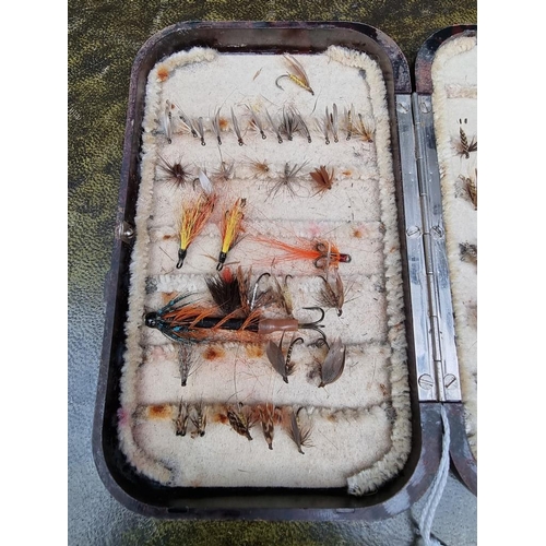 1496 - Angling: a Hardy Bakelite Oxblood dry fly fishing box, enclosing various flies.