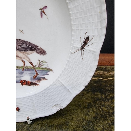 1500 - A 19th century Meissen plate, painted with a wading bird and insects, with basketweave boarder, 24.5... 