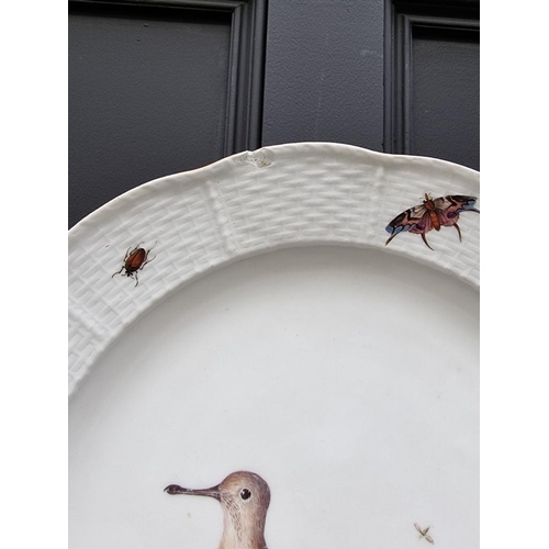 1500 - A 19th century Meissen plate, painted with a wading bird and insects, with basketweave boarder, 24.5... 