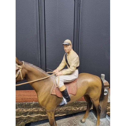 1503 - A novelty cold painted spelter horse and jockey table lighter, 17cm high. ... 