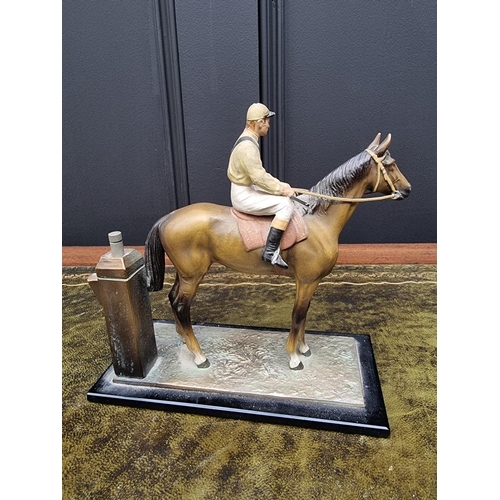 1503 - A novelty cold painted spelter horse and jockey table lighter, 17cm high. ... 