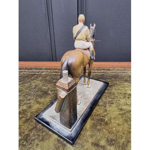 1503 - A novelty cold painted spelter horse and jockey table lighter, 17cm high. ... 