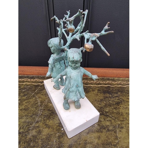 1507 - WITHDRAWN FROM SALE: a verdigris bronze figure group of two children under a fruit tree, 21cm high.... 