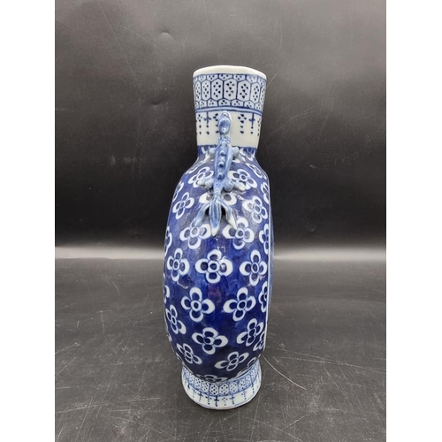 1518 - A Chinese blue and white twin handled moon flask, late 19th century, 24.5cm high.