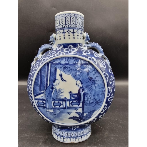 1518 - A Chinese blue and white twin handled moon flask, late 19th century, 24.5cm high.