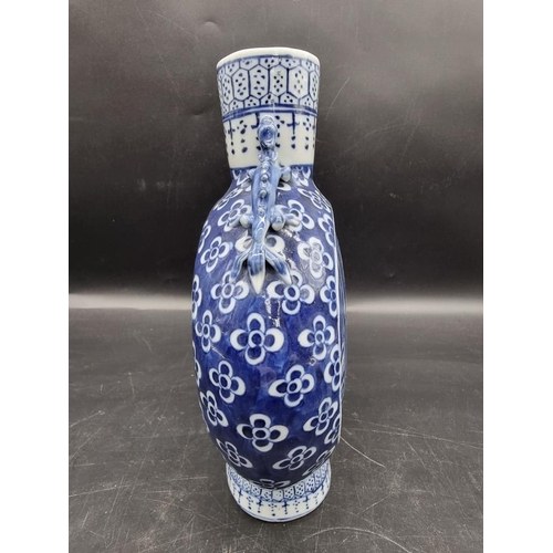 1518 - A Chinese blue and white twin handled moon flask, late 19th century, 24.5cm high.