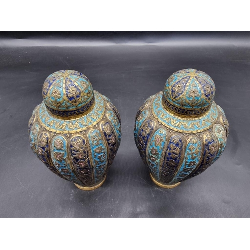 1521 - A pair of Kashmir enamel ovoid vases and covers, 19th century, 16cm high.