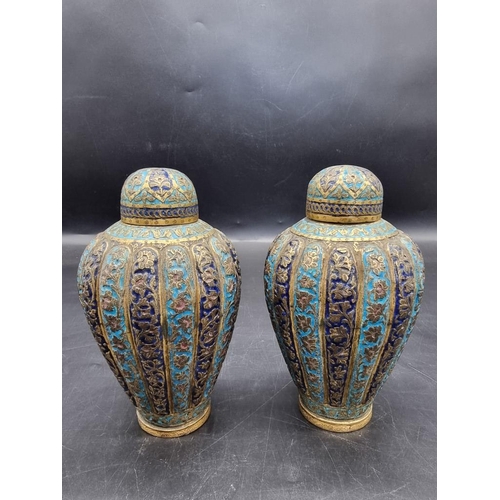 1521 - A pair of Kashmir enamel ovoid vases and covers, 19th century, 16cm high.