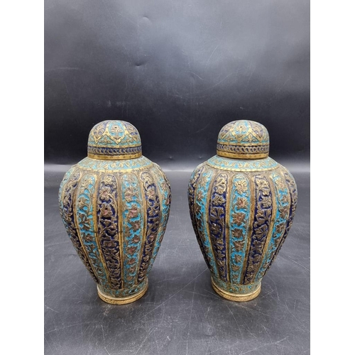 1521 - A pair of Kashmir enamel ovoid vases and covers, 19th century, 16cm high.