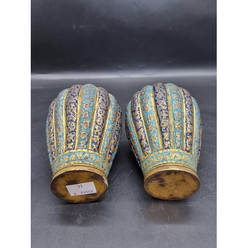 1521 - A pair of Kashmir enamel ovoid vases and covers, 19th century, 16cm high.