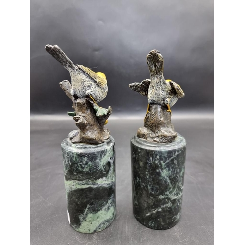 1523 - A pair of cold painted bronze birds, on marble socles, 22.5cm wide. 