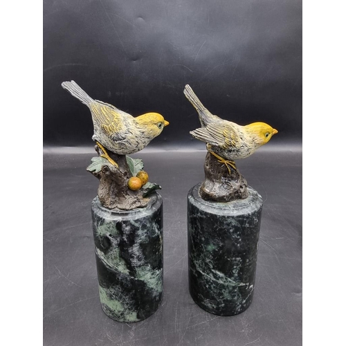 1523 - A pair of cold painted bronze birds, on marble socles, 22.5cm wide. 