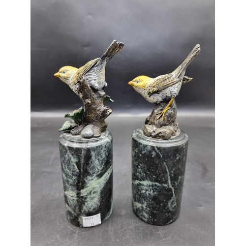 1523 - A pair of cold painted bronze birds, on marble socles, 22.5cm wide. 