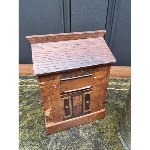 1549 - A 19th century antique treen money box of architectural form, 13cm high; together with another antiq... 