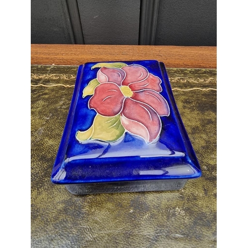 1553 - A Moorcroft rectangular box and cover, 12.5cm wide. 