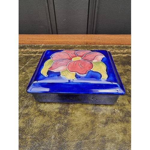 1553 - A Moorcroft rectangular box and cover, 12.5cm wide. 