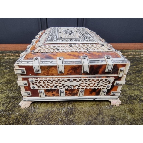 1558 - A small antique tortoiseshell and bone casket, 16cm wide, (s.d.).