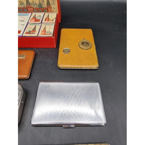 1580 - A collection of cigarette cases; together with a box of Eastern European matchboxes. ... 