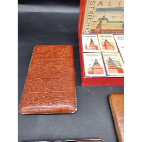 1580 - A collection of cigarette cases; together with a box of Eastern European matchboxes. ... 