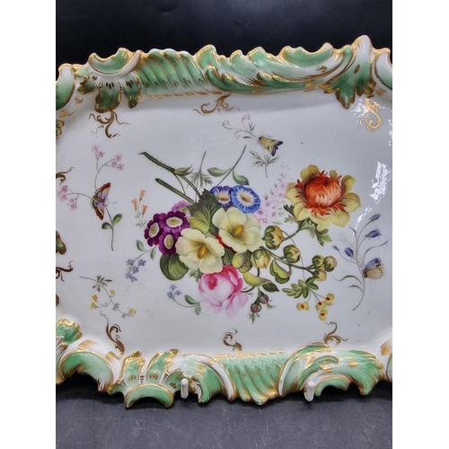 1600 - A 19th century porcelain dish or stand, possibly Rockingham, painted with flowers and butterflies, 3... 