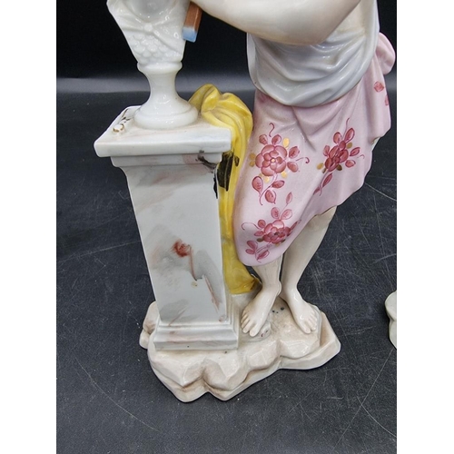 1601 - A pair of Continental porcelain figures, emblematic of the muses, 20.5cm high.