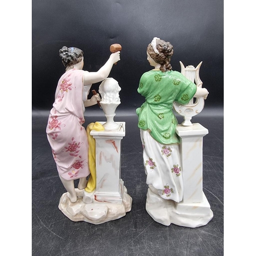 1601 - A pair of Continental porcelain figures, emblematic of the muses, 20.5cm high.