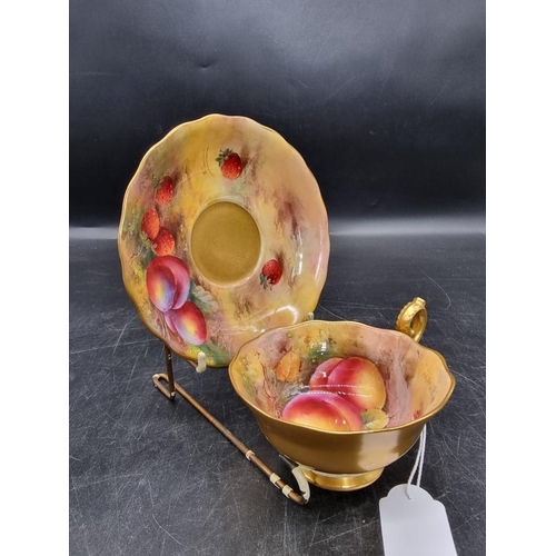 1604 - A Royal Worcester fruit painted cabinet cup and saucer, circa 1926, the cup painted by H G Mose... 