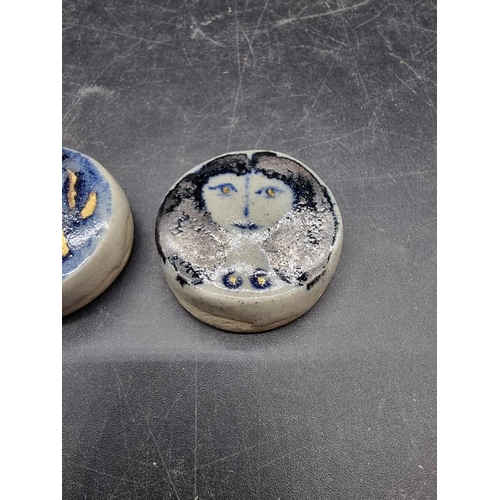 1609 - Studio Pottery: two small Eric James Mellon portrait roundels, 3.7cm diameter.