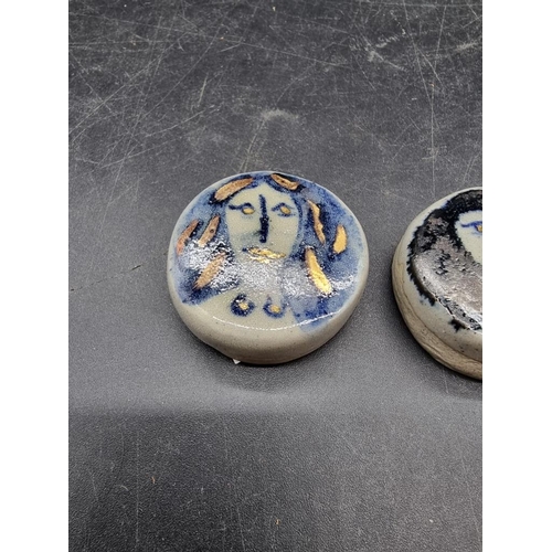 1609 - Studio Pottery: two small Eric James Mellon portrait roundels, 3.7cm diameter.