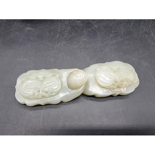 1612 - A large Chinese celadon jade buckle, relief carved with peaches, conjoined width 12.5cm, inset into ... 