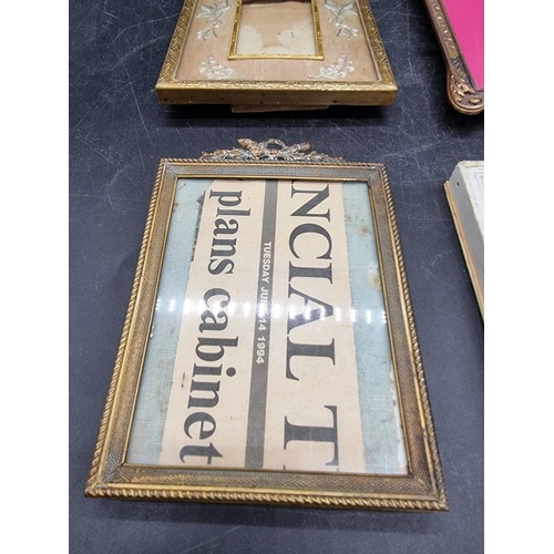 1617 - A small cast copper easel back frame, 19.5 x 12.5cm; together with three further small frames. (4)... 