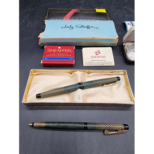 1630 - A small group of vintage pens, to include Lady Sheaffer, with 14k nib; and another Parker with ... 