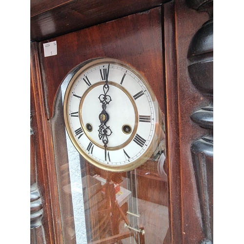 1685 - A late 19th century walnut Vienna style wall clock, spring driven, 85cm high, with pendulum.&nb... 